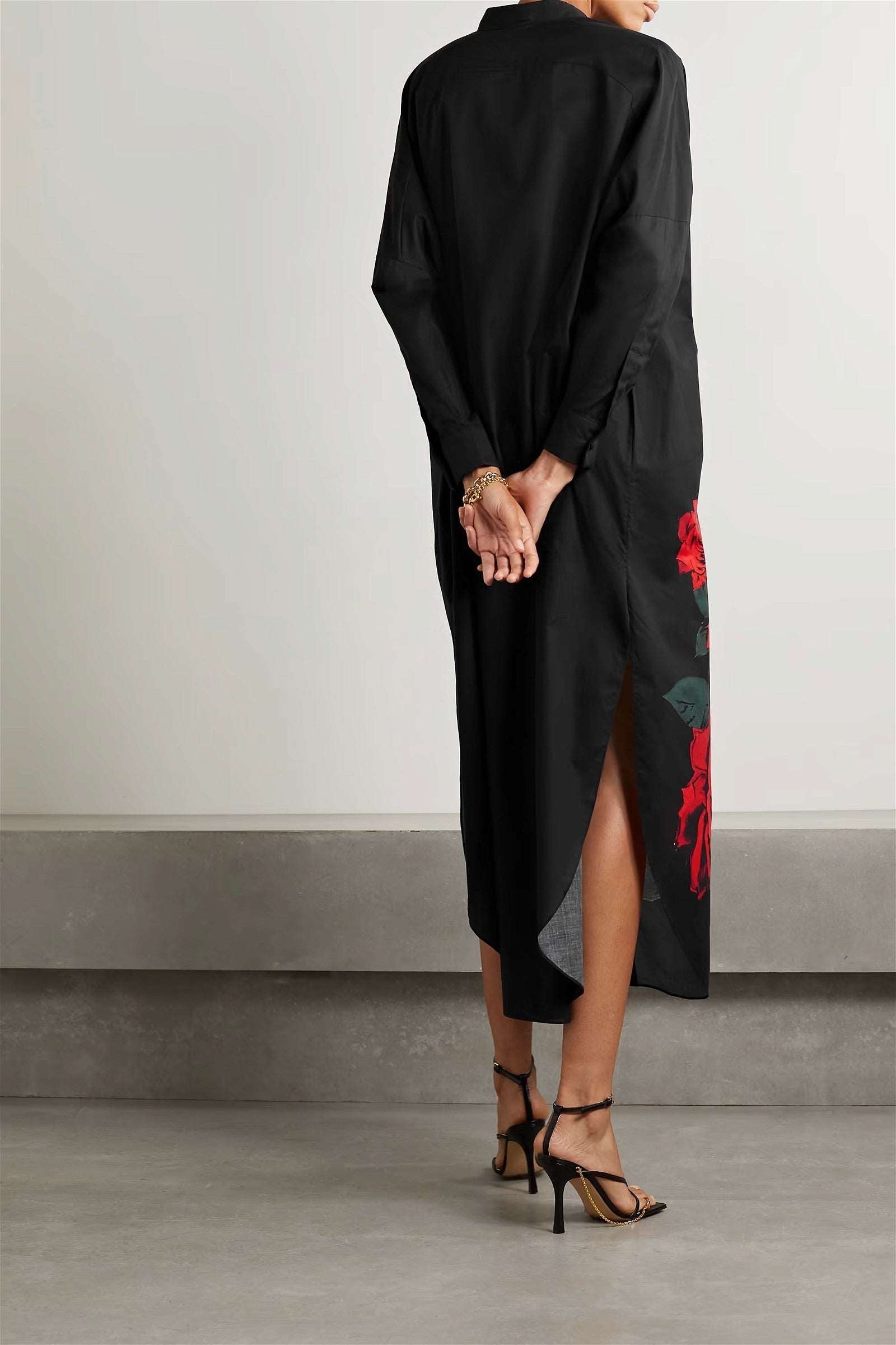 The model in the image is wearing Black And Red Rayon Cotton Party Style Dress For Women from Alice Milan. Crafted with the finest materials and impeccable attention to detail, the Partywear Dress looks premium, trendy, luxurious and offers unparalleled comfort. It’s a perfect clothing option for loungewear, resort wear, party wear or for an airport look. The woman in the image looks happy, and confident with her style statement putting a happy smile on her face.