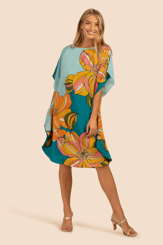 The model in the image is wearing Floral Printed Soft Silk Crepe Womens Kaftan from Alice Milan. Crafted with the finest materials and impeccable attention to detail, the Kaftan / Dress looks premium, trendy, luxurious and offers unparalleled comfort. It’s a perfect clothing option for loungewear, resort wear, party wear or for an airport look. The woman in the image looks happy, and confident with her style statement putting a happy smile on her face.