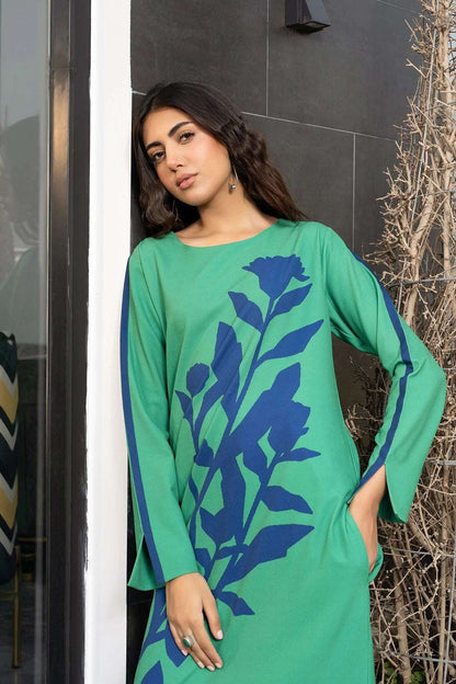 The model in the image is wearing Green Colour Designer Casual Wear Korean BSY Dress from Alice Milan. Crafted with the finest materials and impeccable attention to detail, the Dress looks premium, trendy, luxurious and offers unparalleled comfort. It’s a perfect clothing option for loungewear, resort wear, party wear or for an airport look. The woman in the image looks happy, and confident with her style statement putting a happy smile on her face.