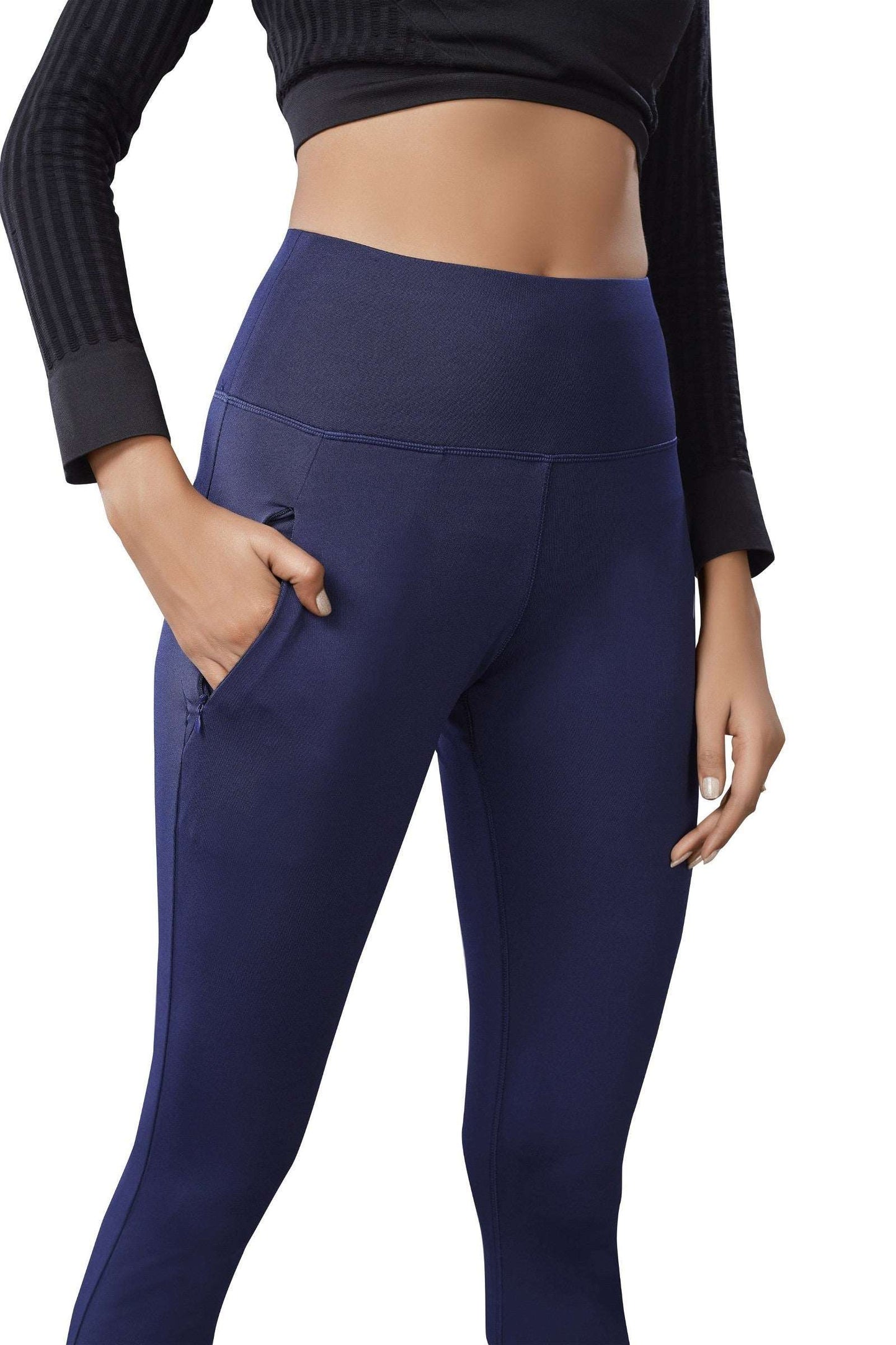 The model in the image is wearing Blue Colour Polyester Solid Pattern Track Pant For Women's from Alice Milan. Crafted with the finest materials and impeccable attention to detail, the Track Pant looks premium, trendy, luxurious and offers unparalleled comfort. It’s a perfect clothing option for loungewear, resort wear, party wear or for an airport look. The woman in the image looks happy, and confident with her style statement putting a happy smile on her face.