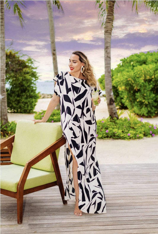 The model in the image is wearing Monochrome Chic from Alice Milan. Crafted with the finest materials and impeccable attention to detail, the Dress looks premium, trendy, luxurious and offers unparalleled comfort. It’s a perfect clothing option for loungewear, resort wear, party wear or for an airport look. The woman in the image looks happy, and confident with her style statement putting a happy smile on her face.