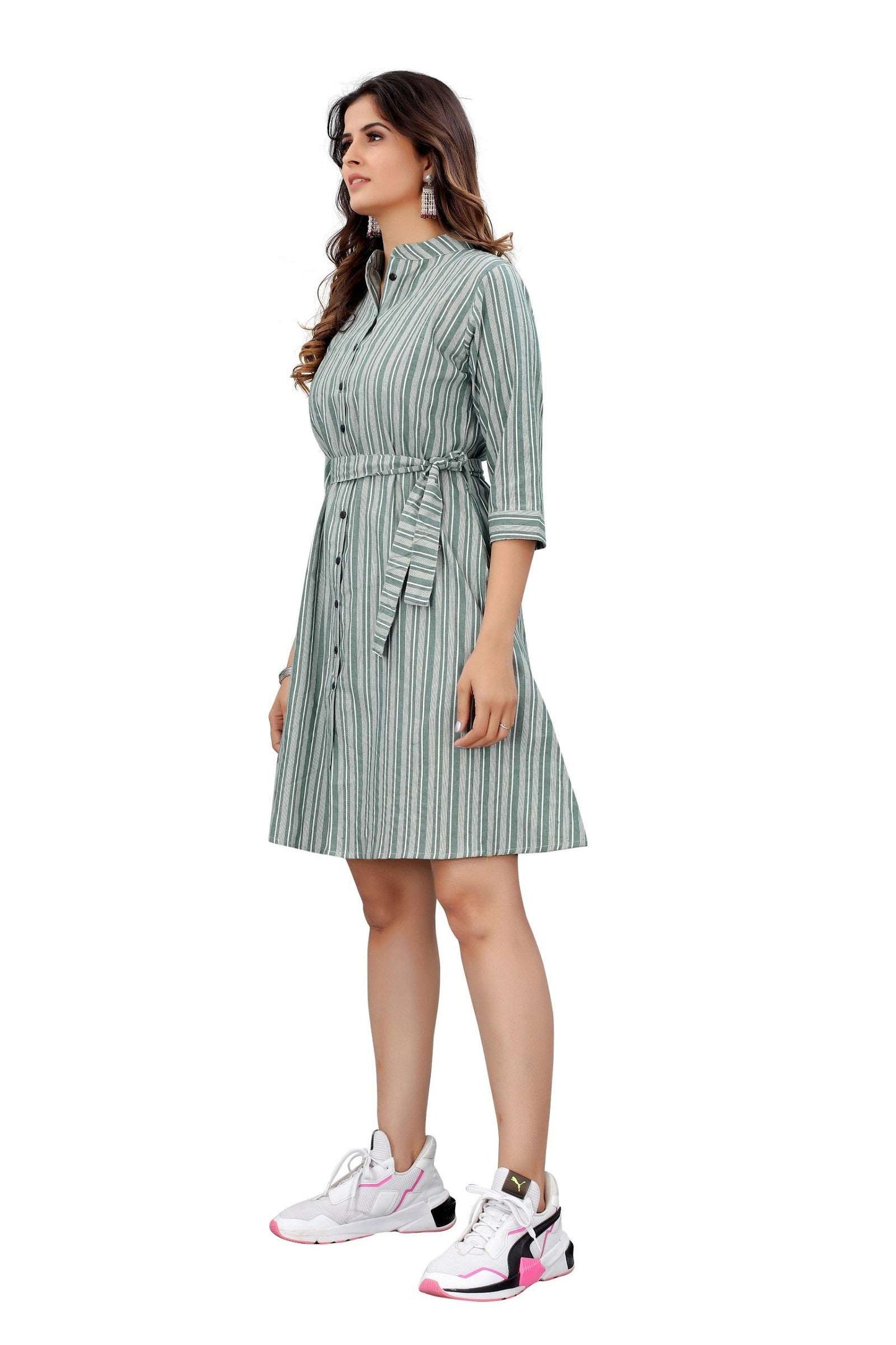 The model in the image is wearing Green Colour Cotton Printed Casual Wear Dress from Alice Milan. Crafted with the finest materials and impeccable attention to detail, the Dress looks premium, trendy, luxurious and offers unparalleled comfort. It’s a perfect clothing option for loungewear, resort wear, party wear or for an airport look. The woman in the image looks happy, and confident with her style statement putting a happy smile on her face.