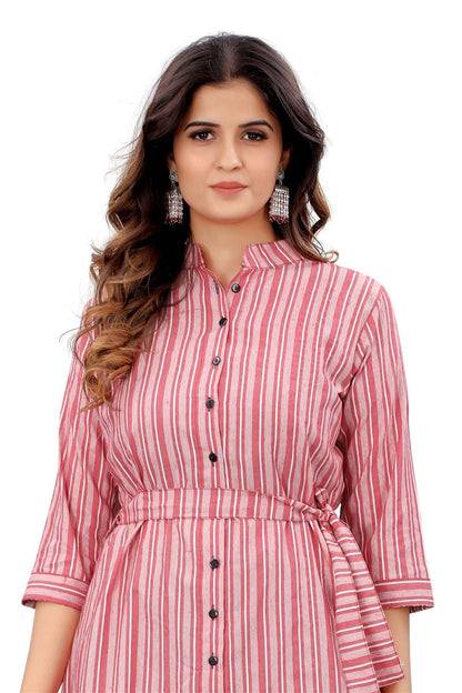 The model in the image is wearing Pink Colour Cotton Printed Casual Wear Dress from Alice Milan. Crafted with the finest materials and impeccable attention to detail, the Dress looks premium, trendy, luxurious and offers unparalleled comfort. It’s a perfect clothing option for loungewear, resort wear, party wear or for an airport look. The woman in the image looks happy, and confident with her style statement putting a happy smile on her face.