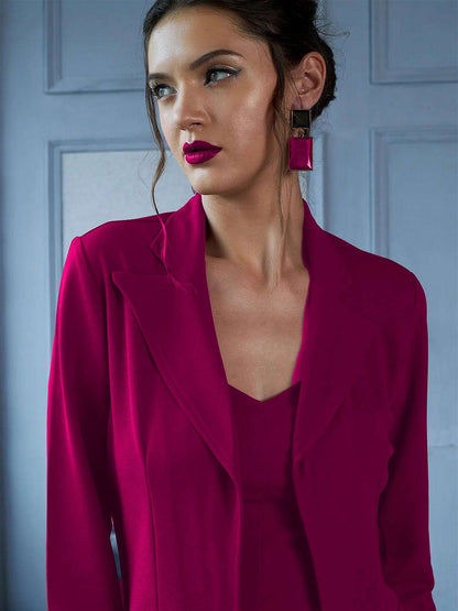 The model in the image is wearing EnVogue Chic - Hot Pink Blazer Co ord from Alice Milan. Crafted with the finest materials and impeccable attention to detail, the Formal Suit looks premium, trendy, luxurious and offers unparalleled comfort. It’s a perfect clothing option for loungewear, resort wear, party wear or for an airport look. The woman in the image looks happy, and confident with her style statement putting a happy smile on her face.