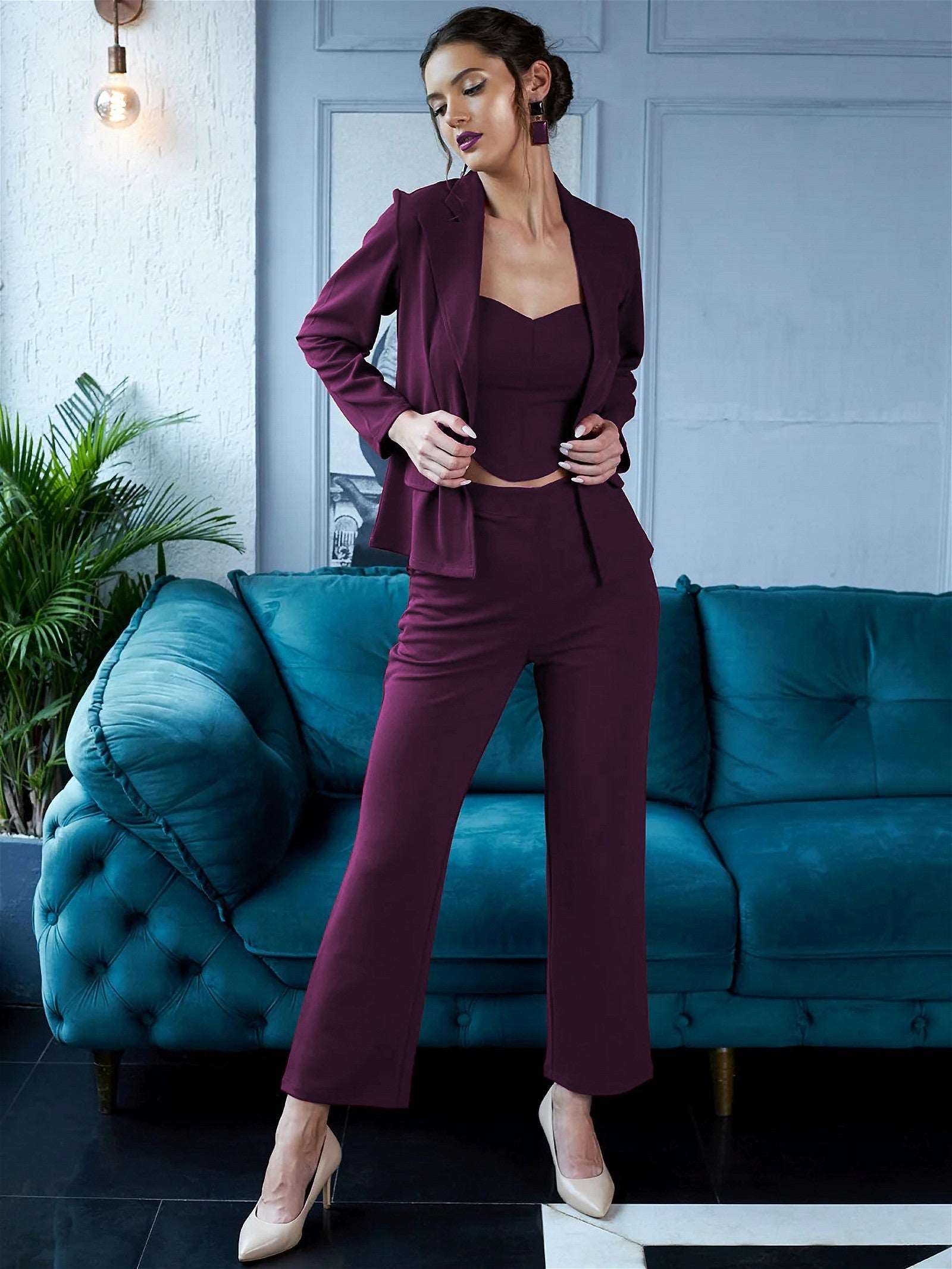 The model in the image is wearing Amethyst - 3 Piece Purple Co ord Set from Alice Milan. Crafted with the finest materials and impeccable attention to detail, the Formal Suit looks premium, trendy, luxurious and offers unparalleled comfort. It’s a perfect clothing option for loungewear, resort wear, party wear or for an airport look. The woman in the image looks happy, and confident with her style statement putting a happy smile on her face.