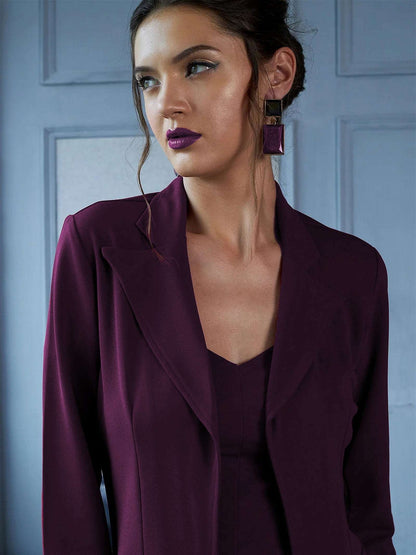 The model in the image is wearing Amethyst - 3 Piece Purple Co ord Set from Alice Milan. Crafted with the finest materials and impeccable attention to detail, the Formal Suit looks premium, trendy, luxurious and offers unparalleled comfort. It’s a perfect clothing option for loungewear, resort wear, party wear or for an airport look. The woman in the image looks happy, and confident with her style statement putting a happy smile on her face.