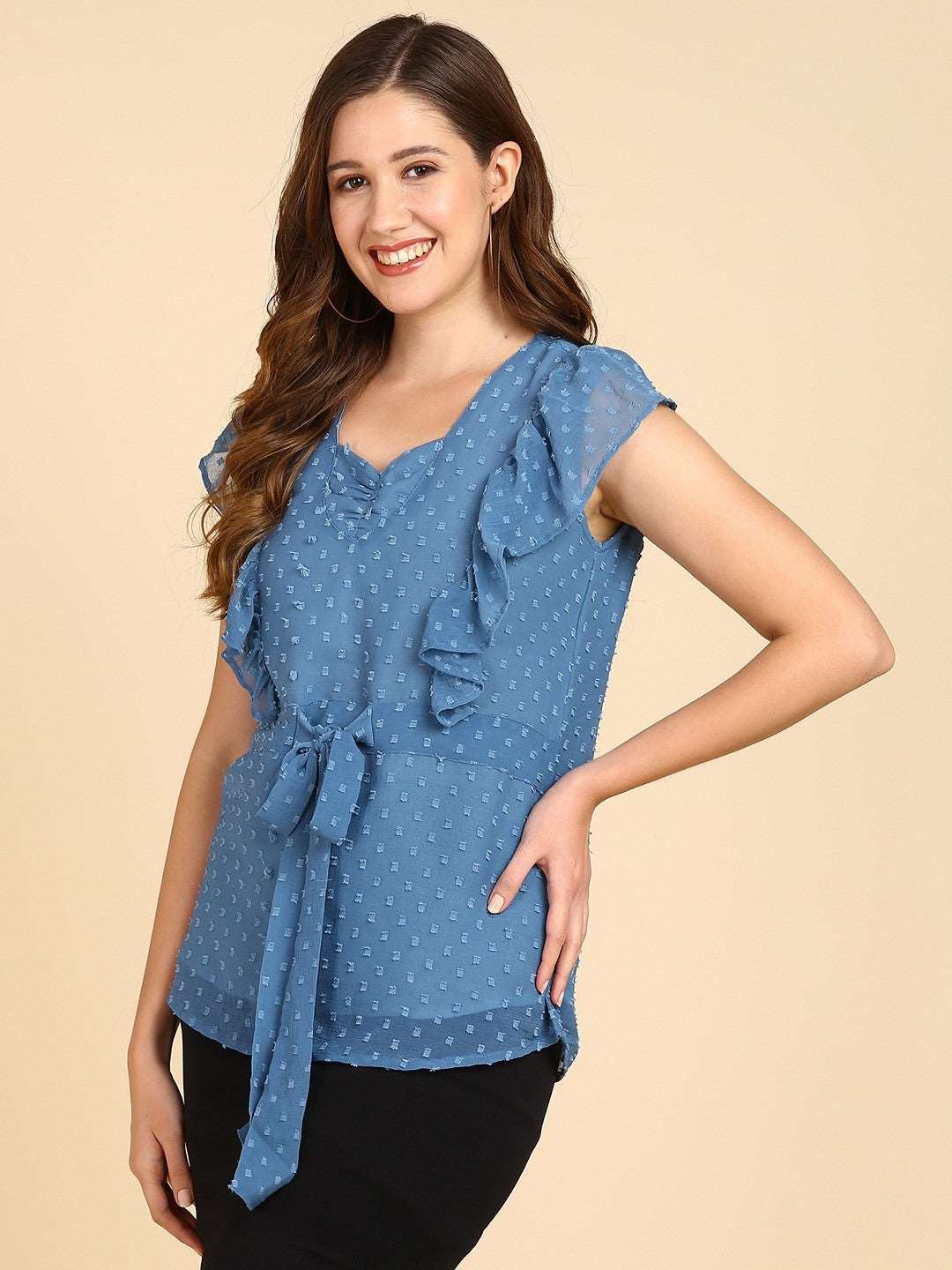 The model in the image is wearing Casual Self Design Women Blue Sweetheart Neck Top from Alice Milan. Crafted with the finest materials and impeccable attention to detail, the Western Wear Top looks premium, trendy, luxurious and offers unparalleled comfort. It’s a perfect clothing option for loungewear, resort wear, party wear or for an airport look. The woman in the image looks happy, and confident with her style statement putting a happy smile on her face.