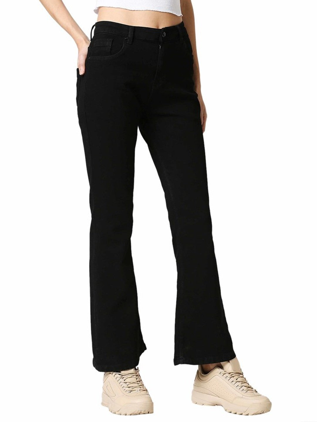 The model in the image is wearing Black Women Bootcut Denim Jeans from Alice Milan. Crafted with the finest materials and impeccable attention to detail, the Jeans looks premium, trendy, luxurious and offers unparalleled comfort. It’s a perfect clothing option for loungewear, resort wear, party wear or for an airport look. The woman in the image looks happy, and confident with her style statement putting a happy smile on her face.