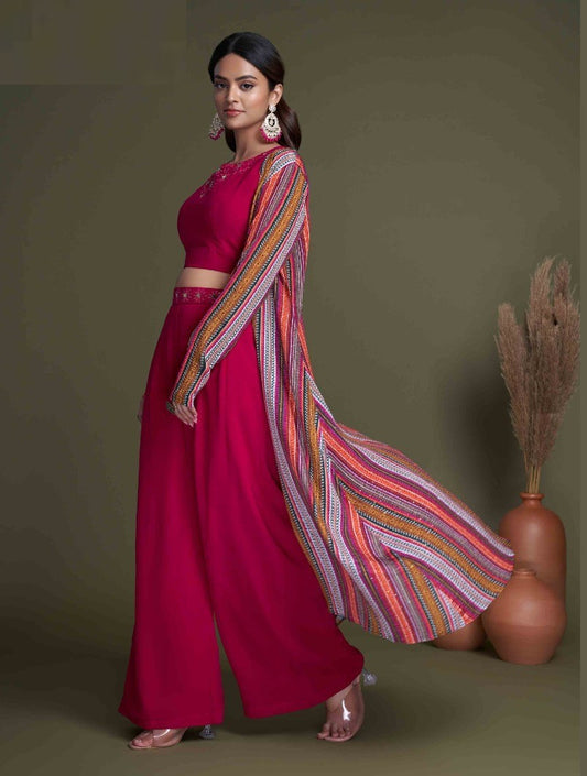 The model in the image is wearing Rani Stylish Indo Western For Women from Alice Milan. Crafted with the finest materials and impeccable attention to detail, the  looks premium, trendy, luxurious and offers unparalleled comfort. It’s a perfect clothing option for loungewear, resort wear, party wear or for an airport look. The woman in the image looks happy, and confident with her style statement putting a happy smile on her face.