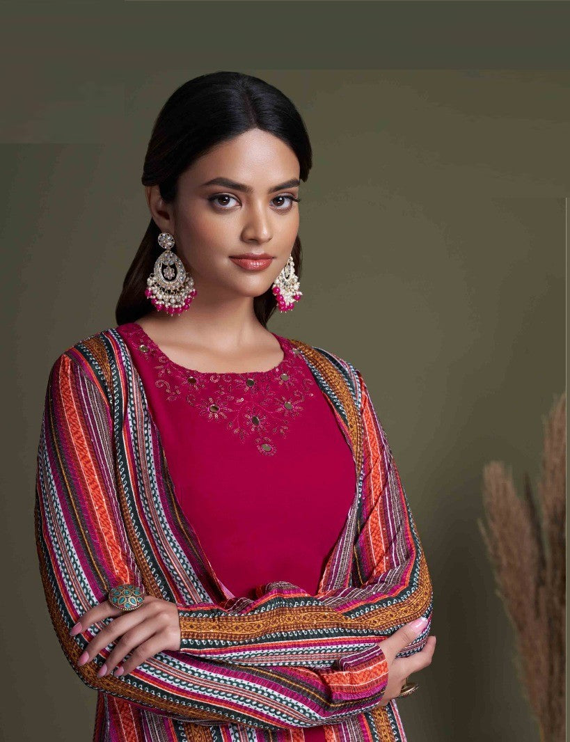 The model in the image is wearing Rani Stylish Indo Western For Women from Alice Milan. Crafted with the finest materials and impeccable attention to detail, the  looks premium, trendy, luxurious and offers unparalleled comfort. It’s a perfect clothing option for loungewear, resort wear, party wear or for an airport look. The woman in the image looks happy, and confident with her style statement putting a happy smile on her face.