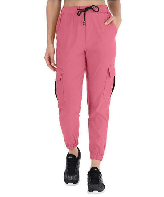 The model in the image is wearing Muted Pink Double Pocket Corgo Pant from Alice Milan. Crafted with the finest materials and impeccable attention to detail, the Cargo Pant looks premium, trendy, luxurious and offers unparalleled comfort. It’s a perfect clothing option for loungewear, resort wear, party wear or for an airport look. The woman in the image looks happy, and confident with her style statement putting a happy smile on her face.