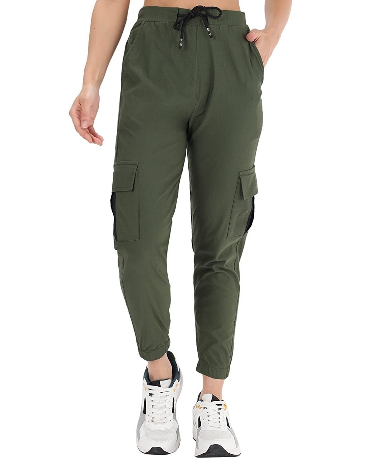 The model in the image is wearing Army Green Double Pocket Corgo Pant from Alice Milan. Crafted with the finest materials and impeccable attention to detail, the Cargo Pant looks premium, trendy, luxurious and offers unparalleled comfort. It’s a perfect clothing option for loungewear, resort wear, party wear or for an airport look. The woman in the image looks happy, and confident with her style statement putting a happy smile on her face.