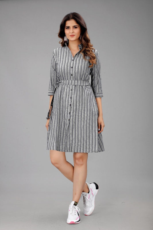 The model in the image is wearing Grey Colour Cotton Printed Casual Wear Dress from Alice Milan. Crafted with the finest materials and impeccable attention to detail, the Dress looks premium, trendy, luxurious and offers unparalleled comfort. It’s a perfect clothing option for loungewear, resort wear, party wear or for an airport look. The woman in the image looks happy, and confident with her style statement putting a happy smile on her face.