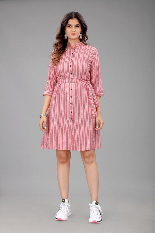 The model in the image is wearing Pink Colour Cotton Printed Casual Wear Dress from Alice Milan. Crafted with the finest materials and impeccable attention to detail, the Dress looks premium, trendy, luxurious and offers unparalleled comfort. It’s a perfect clothing option for loungewear, resort wear, party wear or for an airport look. The woman in the image looks happy, and confident with her style statement putting a happy smile on her face.