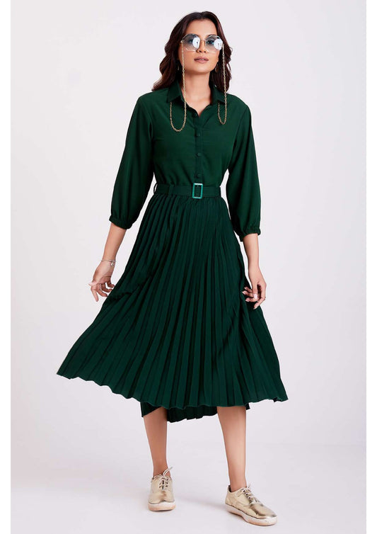 The model in the image is wearing Green Pan Collar Pleated Western Wear dress for women from Alice Milan. Crafted with the finest materials and impeccable attention to detail, the Dress looks premium, trendy, luxurious and offers unparalleled comfort. It’s a perfect clothing option for loungewear, resort wear, party wear or for an airport look. The woman in the image looks happy, and confident with her style statement putting a happy smile on her face.