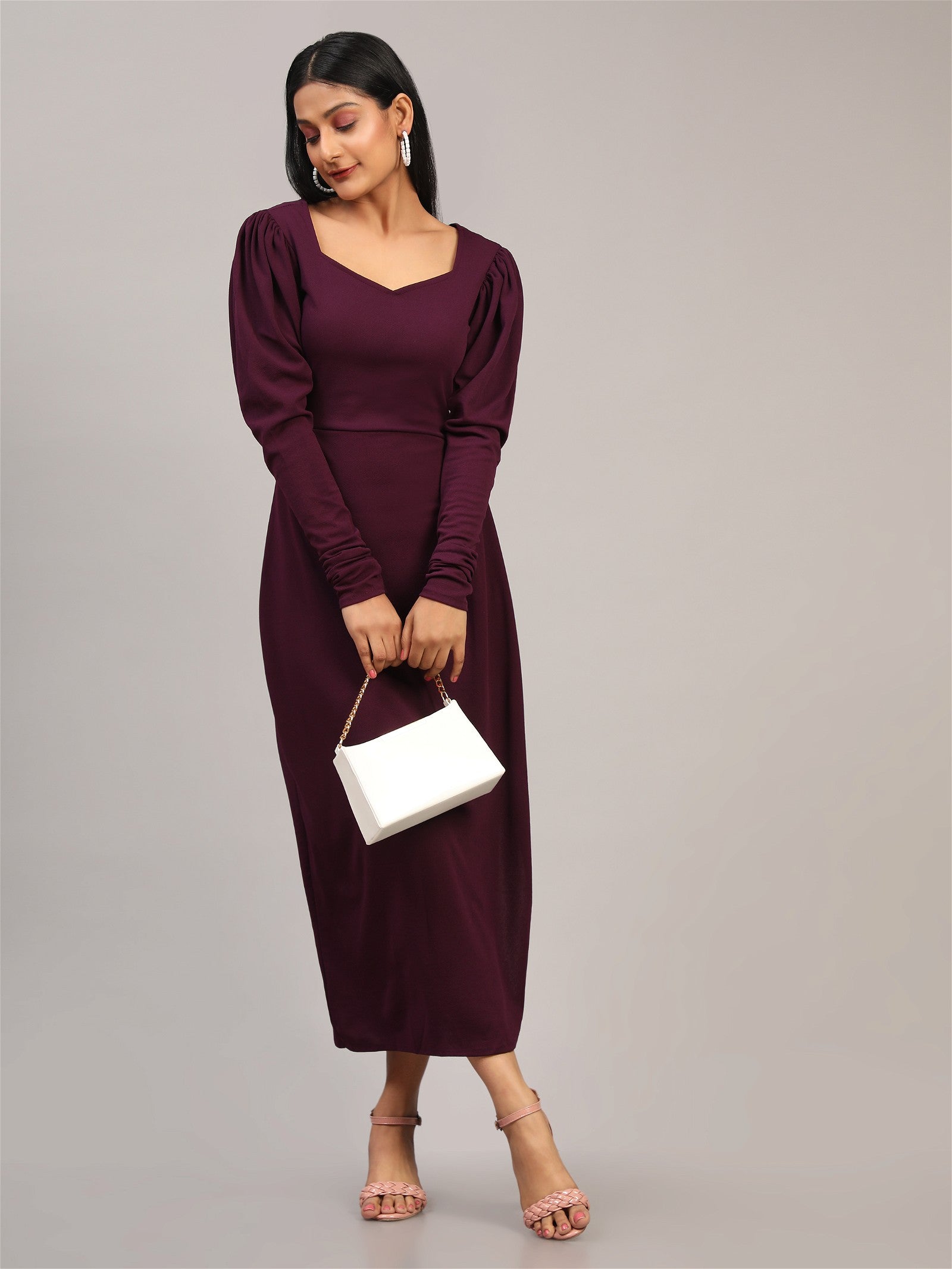 The model in the image is wearing Cotton Lycra tops Western Wear Collection from Alice Milan. Crafted with the finest materials and impeccable attention to detail, the Dress looks premium, trendy, luxurious and offers unparalleled comfort. It’s a perfect clothing option for loungewear, resort wear, party wear or for an airport look. The woman in the image looks happy, and confident with her style statement putting a happy smile on her face.