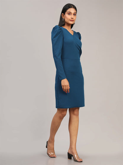 The model in the image is wearing Blue Bodycon Casual Knee Length Dress from Alice Milan. Crafted with the finest materials and impeccable attention to detail, the Dress looks premium, trendy, luxurious and offers unparalleled comfort. It’s a perfect clothing option for loungewear, resort wear, party wear or for an airport look. The woman in the image looks happy, and confident with her style statement putting a happy smile on her face.