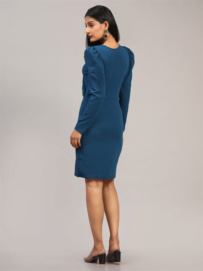 The model in the image is wearing Blue Bodycon Casual Knee Length Dress from Alice Milan. Crafted with the finest materials and impeccable attention to detail, the Dress looks premium, trendy, luxurious and offers unparalleled comfort. It’s a perfect clothing option for loungewear, resort wear, party wear or for an airport look. The woman in the image looks happy, and confident with her style statement putting a happy smile on her face.