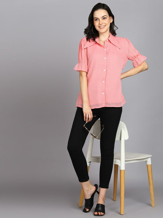 The model in the image is wearing Casual Regular Sleeves Self Design Women Pink Top from Alice Milan. Crafted with the finest materials and impeccable attention to detail, the Western Wear Top looks premium, trendy, luxurious and offers unparalleled comfort. It’s a perfect clothing option for loungewear, resort wear, party wear or for an airport look. The woman in the image looks happy, and confident with her style statement putting a happy smile on her face.