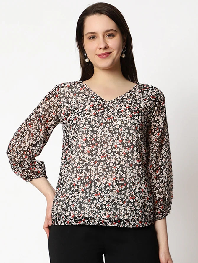 The model in the image is wearing Casual Printed Women Multicolor Round Neck Top from Alice Milan. Crafted with the finest materials and impeccable attention to detail, the Western Wear Top looks premium, trendy, luxurious and offers unparalleled comfort. It’s a perfect clothing option for loungewear, resort wear, party wear or for an airport look. The woman in the image looks happy, and confident with her style statement putting a happy smile on her face.