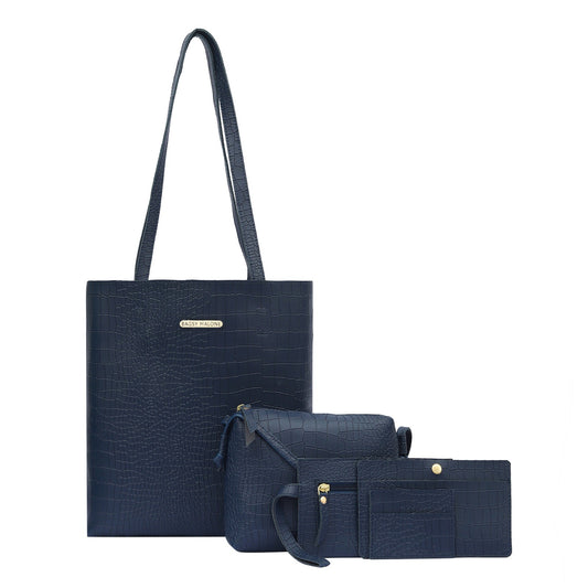 The model in the image is wearing Navy Blue Pack Of 5 Structured Tote Bag from Alice Milan. Crafted with the finest materials and impeccable attention to detail, the  looks premium, trendy, luxurious and offers unparalleled comfort. It’s a perfect clothing option for loungewear, resort wear, party wear or for an airport look. The woman in the image looks happy, and confident with her style statement putting a happy smile on her face.