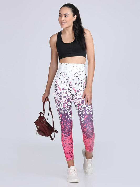 The model in the image is wearing FlexFit Fusion Leggings from Alice Milan. Crafted with the finest materials and impeccable attention to detail, the Leggings looks premium, trendy, luxurious and offers unparalleled comfort. It’s a perfect clothing option for loungewear, resort wear, party wear or for an airport look. The woman in the image looks happy, and confident with her style statement putting a happy smile on her face.